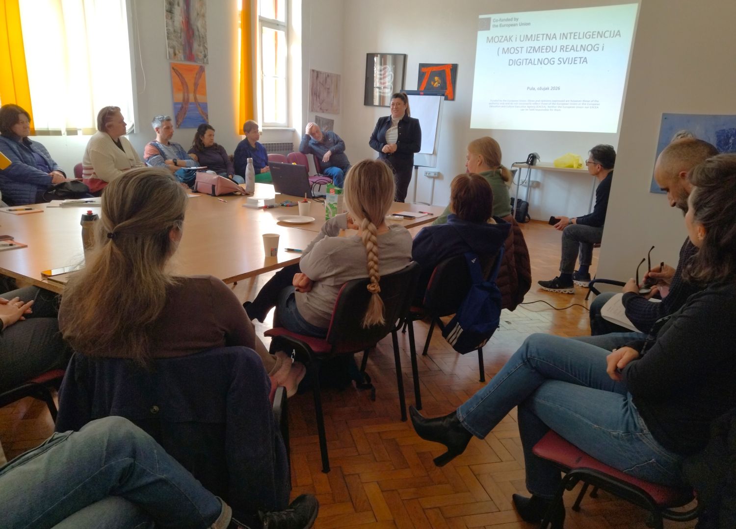 NGO employees during an active discussion about AI application in Pula